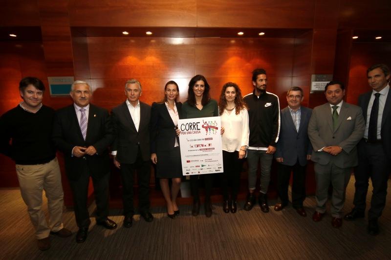 Participantes en la rueda de prensa, junto al cartel